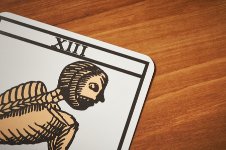 Tarot card death for clairvoyance and divination on wooden table