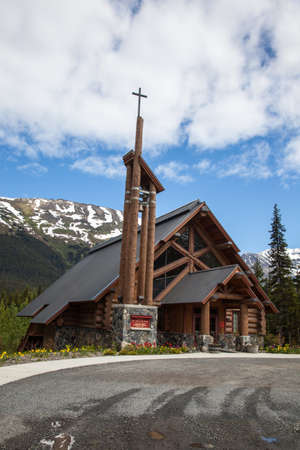 A log construction church sits in a remote Alaska townの写真素材