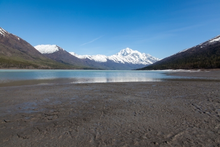A large blue lake begins to melt on a hot spring dayの写真素材