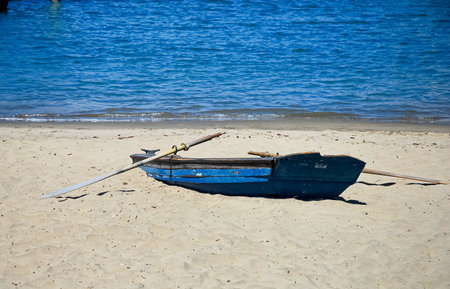 Fishing boat on the sandy beachの写真素材