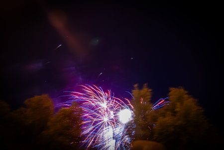 Colorful fireworks of various colors over night sky. Fireworks background.の写真素材