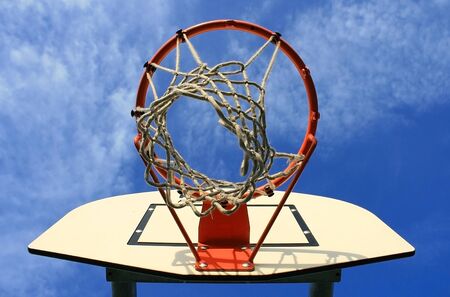 Photo of a basketball hoop on a sunny dayの写真素材