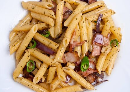 Penne with fried bacon garlic and onionの写真素材