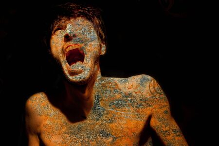 Composition of a screaming man and texture effectの写真素材