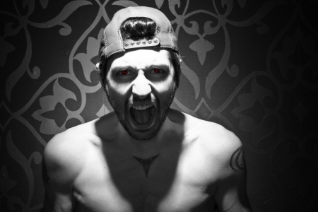 Half naked model with evil eyes screaming