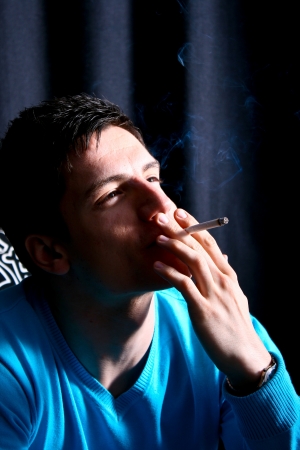 Teenager smoking a cigaretteの写真素材