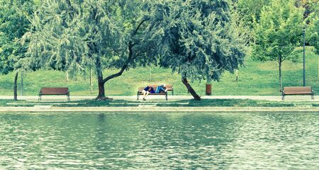 Couple kissing in the parkの写真素材