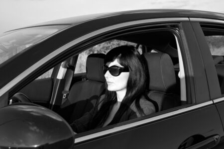 Caucasian woman in the driver's seatの写真素材