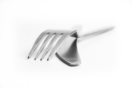Aluminum cutlery on white background (shallow DOF)の写真素材