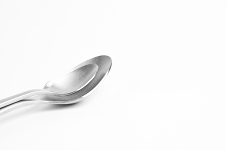 Aluminum cutlery on white background (shallow DOF)の写真素材