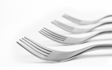 Aluminum cutlery on white background (shallow DOF)の写真素材