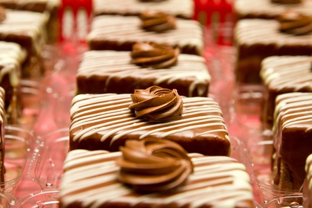 Chocolate cakes with vanilla cream decorationの写真素材