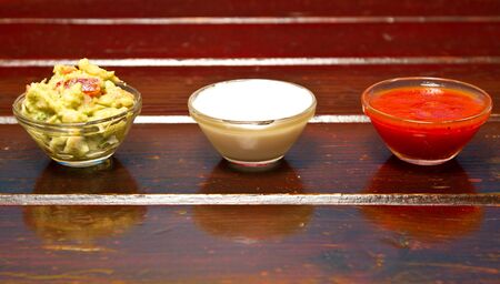 Nachos dips in glass bowls