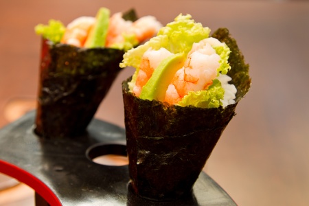 Shrimp salad in a seaweed coneの写真素材
