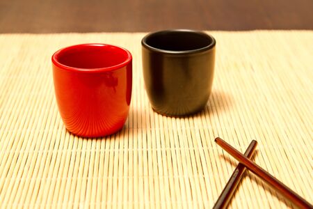 Sake cups with chopsitcks asideの写真素材