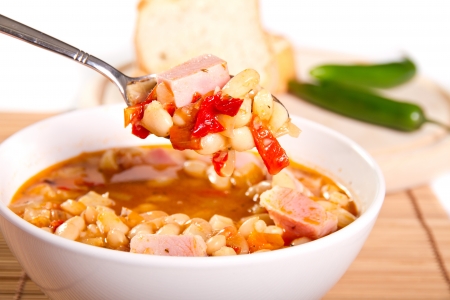 Beans and bacon soup in a bowlの写真素材