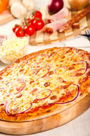 Pizza on a wooden boardの写真素材