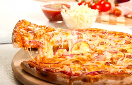 Pizza on a wooden boardの写真素材