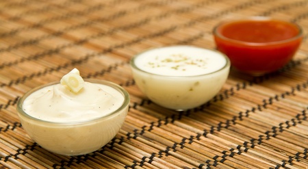 Fresh homemade sauces in glass bowls