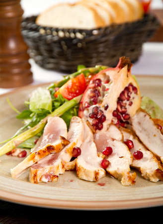Duck breast with pomegranate and saladの写真素材