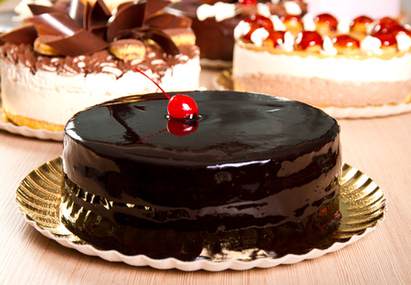 Elegant chocolate cake with a dry cherry decoration