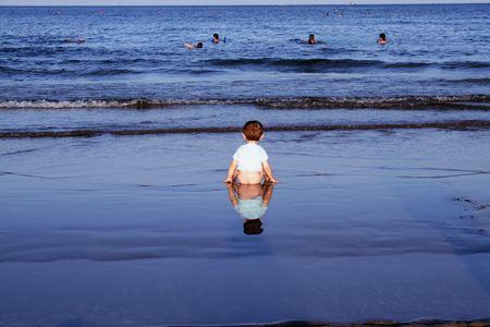 Very young boy by the beachの写真素材