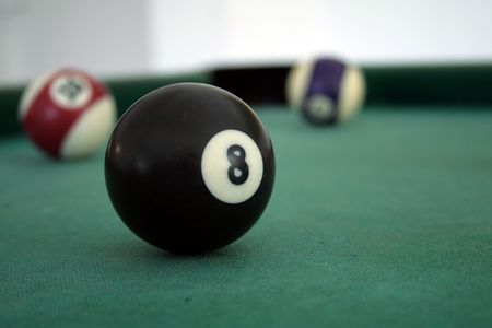 Close-up the ball number eight in snooker game
