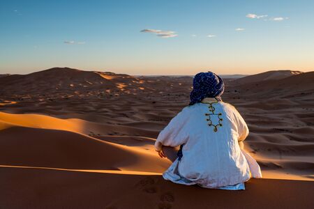 Man looks in the desertの写真素材