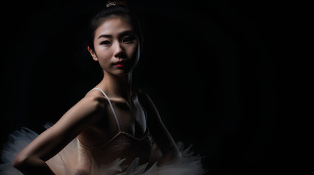 Portrait of beautiful asian woman in white dress on black backgroundの素材