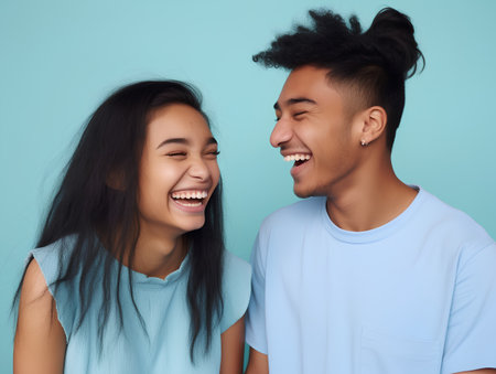 Portrait of happy young Asian couple laughing and looking at each otherの素材