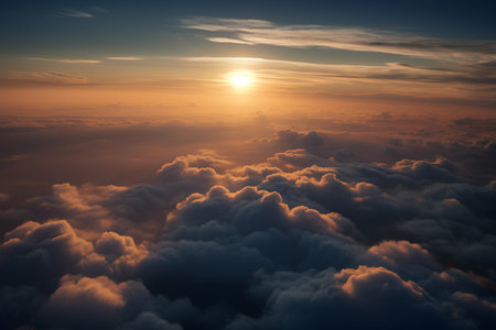 Aerial view of beautiful sunset above the clouds. View from airplane window.の素材
