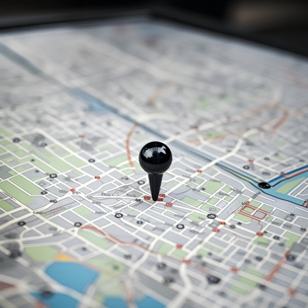 A close up shot of a city map with a black pushpinの素材