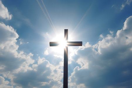 Cross on the background of the blue sky with clouds. Christian symbol.の素材