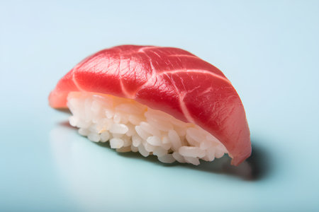 Sushi roll with tuna on a blue background. Toned.の素材