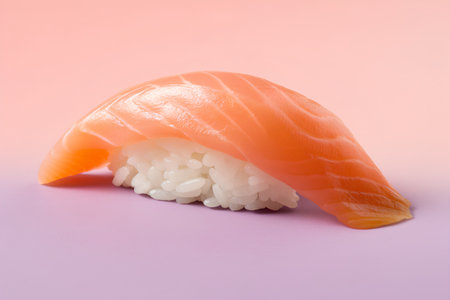 Salmon nigiri sushi with rice on pink background, close upの素材