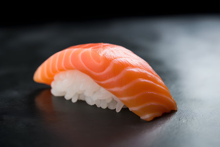 Salmon nigiri sushi on a black background. Japanese food.の素材
