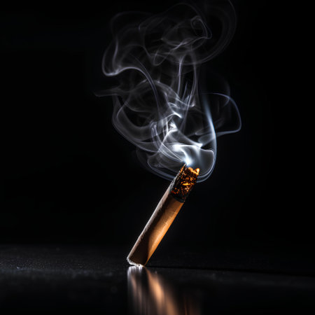 Smoke from a cigarette on a black background. Smoke from a burning cigarette.の素材