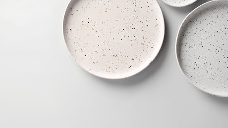 Ceramic plates on a white background, top view, copy spaceの素材