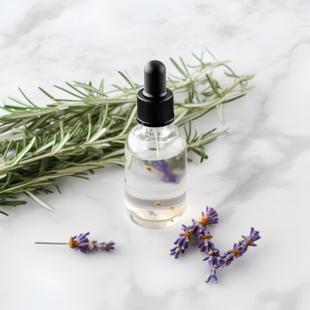 Essential oil with lavender and rosemary on a marble backgroundの素材