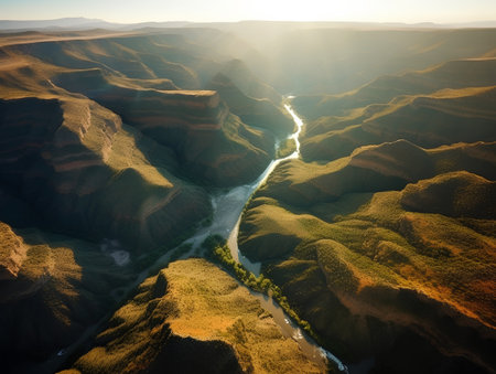 Aerial view of the river bend in the mountains at sunset.の素材