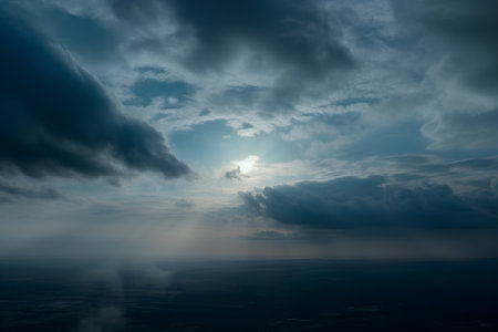 Aerial view of dramatic sky with white clouds and sunbeamsの素材