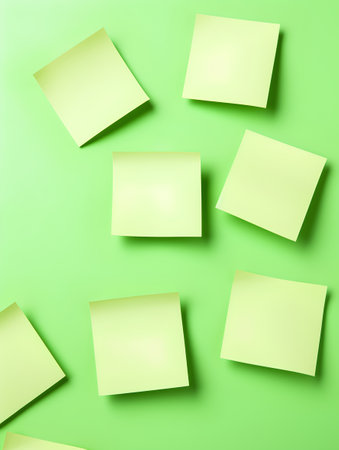 Sticky notes on a green background. 3d rendering. Square.の素材