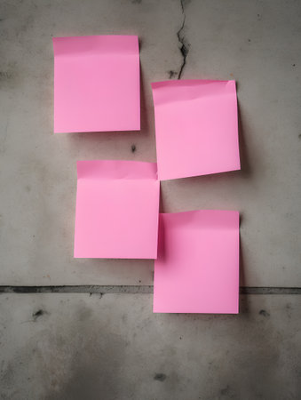 Sticky notes on concrete floor,top view with copy space.の素材