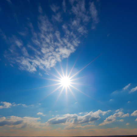 Sunny sky with clouds and sunbeams. Nature composition.の素材