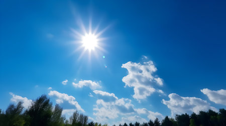 blue sky background with white clouds and sun. natural summer background.の素材