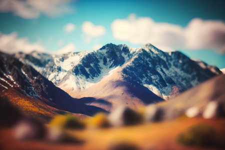 Mountain landscape with snow and blue sky. Vintage style toned pictureの素材