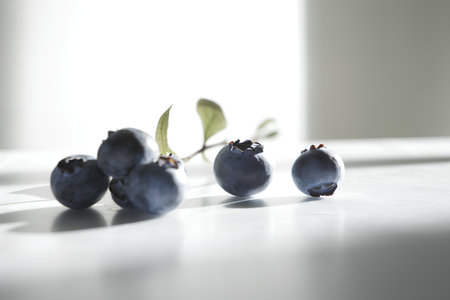 Blueberries on a white table. Shallow depth of field.の素材