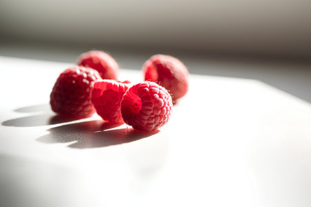 Raspberries on a white background. Selective focus. Toned.の素材