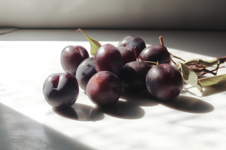 Fresh plums on a white background. Selective focus. Toned.の素材