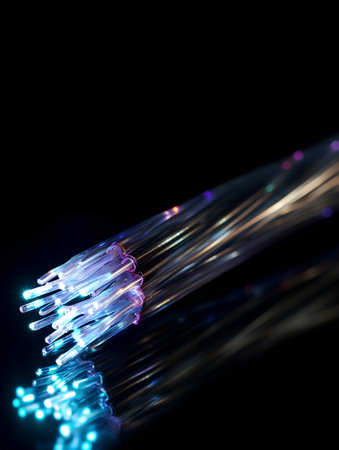Fiber optical network cable closeup with bokeh light effectsの素材